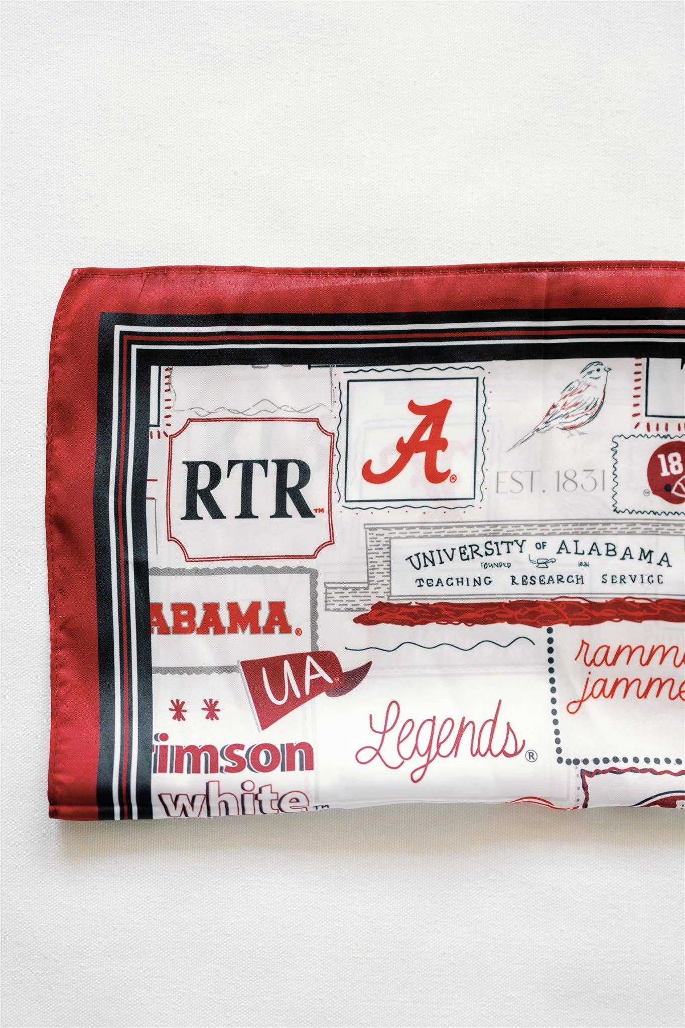 Alabama-themed fabric with logos and text on a white background