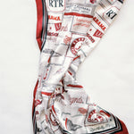 Scarf with red, white, and black pattern on a white background