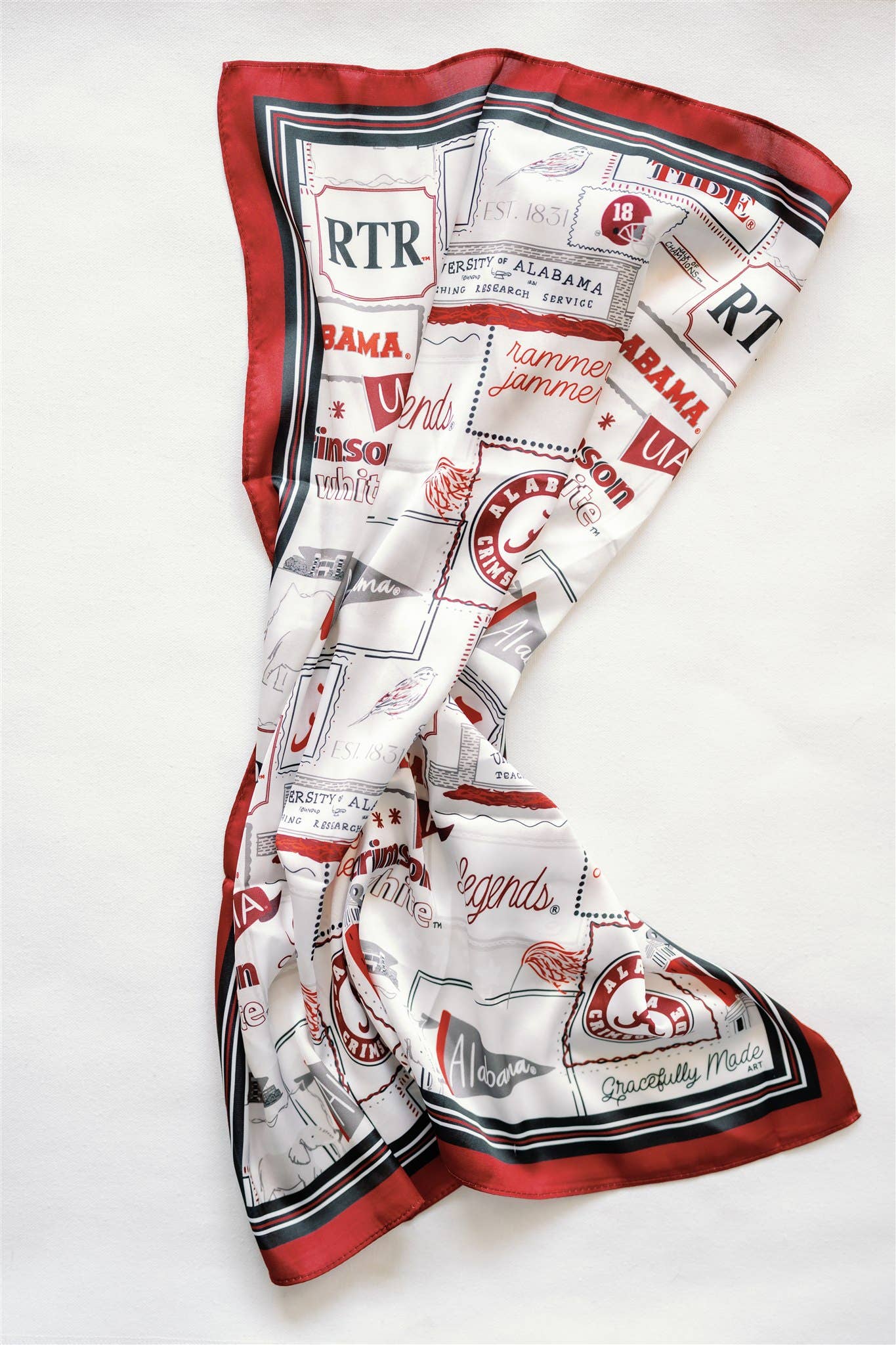 Scarf with red, white, and black pattern on a white background